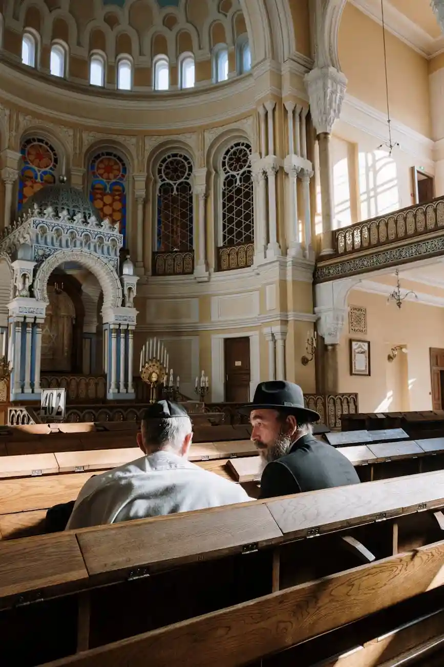 <a href="https://www.pexels.com/photo/back-view-of-a-two-men-sitting-on-pew-5975050/">Photo by cottonbro studio on Pexels</a>