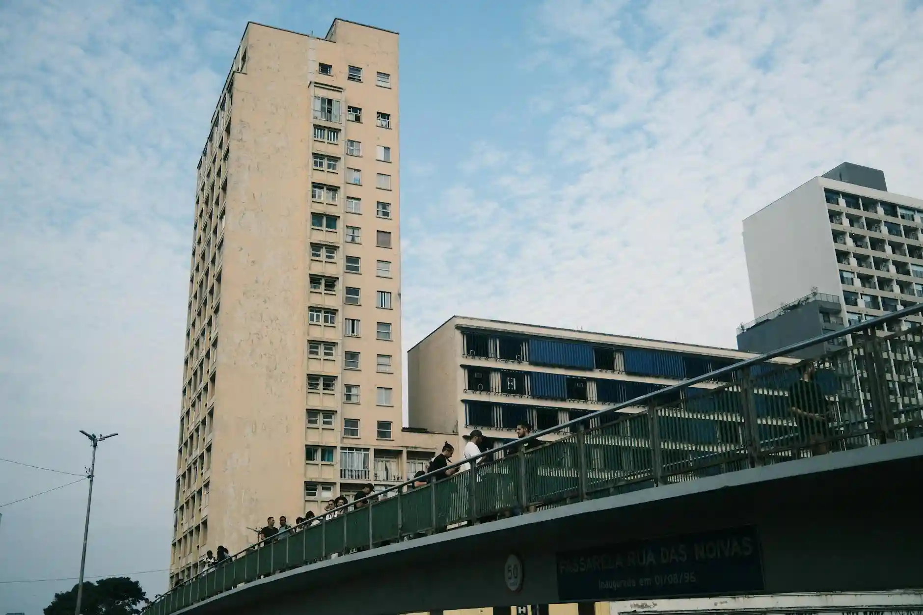 <a href="https://www.pexels.com/photo/urban-skyline-with-pedestrian-bridge-and-buildings-31998717/">Photo by Gustavo Denuncio on Pexels</a>